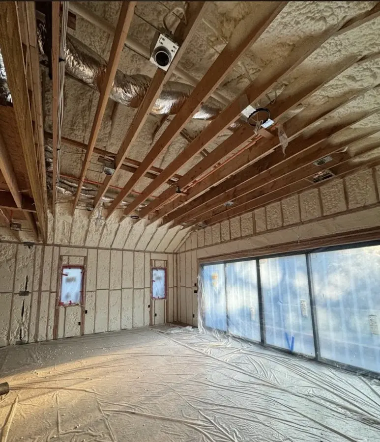 Interior walls and ceiling insulated with spray foam during new construction in Livingston